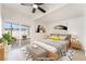 Bedroom with glass doors providing access to an outdoor patio seating area at 6205 Hargrove Ave, Las Vegas, NV 89107