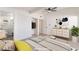 Bright bedroom featuring closet and adjacent bathroom with stylish furnishings and ample natural light at 6205 Hargrove Ave, Las Vegas, NV 89107