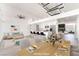 Open-concept dining and living space with modern lighting and bar seating at 6205 Hargrove Ave, Las Vegas, NV 89107