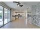 Open floor plan with kitchen featuring granite countertops, tile backsplash, and decorative central island at 6442 Kobe Knoll Ct, Las Vegas, NV 89141