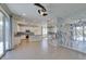 Open floor plan with kitchen featuring granite countertops, tile backsplash, and decorative privacy wall at 6442 Kobe Knoll Ct, Las Vegas, NV 89141