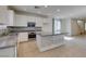 Kitchen with granite countertops, stainless steel appliances, kitchen island and tile flooring at 6442 Kobe Knoll Ct, Las Vegas, NV 89141