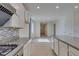 Modern kitchen with granite countertops, an island, and stainless steel appliances at 6442 Kobe Knoll Ct, Las Vegas, NV 89141