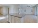 Bright open kitchen with island and great room beyond at 6442 Kobe Knoll Ct, Las Vegas, NV 89141