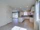 Modern kitchen with white cabinetry, stainless steel appliances, and center island at 6442 Kobe Knoll Ct, Las Vegas, NV 89141