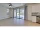 Bright living room featuring tile floors and access to the patio at 6442 Kobe Knoll Ct, Las Vegas, NV 89141