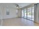 Bright living room featuring tile floors and access to the patio at 6442 Kobe Knoll Ct, Las Vegas, NV 89141