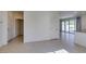 Bright living room featuring tile floors and access to the patio at 6442 Kobe Knoll Ct, Las Vegas, NV 89141