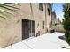 Home's backyard features a sliding glass door, patio, and mature landscaping at 6591 Gertrude Ct, Las Vegas, NV 89141