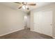 Neutral bedroom features carpet, white trim, a ceiling fan, and a double door closet for optimal storage at 6591 Gertrude Ct, Las Vegas, NV 89141