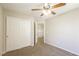 Bedroom with carpet, ceiling fan, closet, and view of the upstairs landing at 6591 Gertrude Ct, Las Vegas, NV 89141