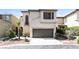 Charming two-story home with a two-car garage and landscaped front yard at 6591 Gertrude Ct, Las Vegas, NV 89141