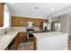 This kitchen features an island, stainless appliances and wooden cabinetry at 6591 Gertrude Ct, Las Vegas, NV 89141