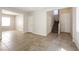 Open living area features tiled floors and access to stairway and additional room at 6591 Gertrude Ct, Las Vegas, NV 89141