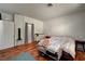 Bedroom features wood floors, neutral walls and window to let in natural light at 7616 Yondering Ave, Las Vegas, NV 89131