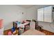 Bright bedroom with wood floor, window, and playful decor at 7616 Yondering Ave, Las Vegas, NV 89131