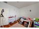 Bedroom featuring wood floor, desk and decor at 7616 Yondering Ave, Las Vegas, NV 89131