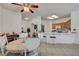 Cozy dining area with a wooden table, white chairs, and a view of the kitchen, perfect for Gathering meals at 7616 Yondering Ave, Las Vegas, NV 89131