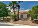 Single-story home with desert landscaping, palm trees, and a tile roof in a residential area at 7616 Yondering Ave, Las Vegas, NV 89131