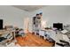 Bright office with hardwood floors, a built-in bookshelf and desk space at 7616 Yondering Ave, Las Vegas, NV 89131