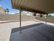 Well-maintained backyard with desert landscaping and covered patio at 8068 Cetus Cir, Las Vegas, NV 89128