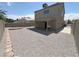 Spacious backyard featuring desert landscaping, patio, and two-story home at 8068 Cetus Cir, Las Vegas, NV 89128