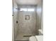 Tiled shower features a rain shower head and recessed niche at 8068 Cetus Cir, Las Vegas, NV 89128