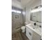 Modern bathroom with glass enclosed shower and stylish vanity with white countertop at 8068 Cetus Cir, Las Vegas, NV 89128