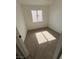 Compact bedroom with natural light, neutral walls, and comfortable carpeting at 8068 Cetus Cir, Las Vegas, NV 89128
