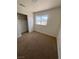 Cozy bedroom featuring soft carpeting and a closet with sliding doors at 8068 Cetus Cir, Las Vegas, NV 89128