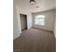 Bright bedroom with an arched window and plush carpeting at 8068 Cetus Cir, Las Vegas, NV 89128