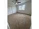 Carpeted bedroom features a window with neighborhood view and a closet with sliding doors at 8068 Cetus Cir, Las Vegas, NV 89128