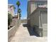 Long driveway leading to backyard with gate and concrete block walls at 8068 Cetus Cir, Las Vegas, NV 89128