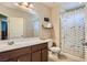 Inviting bathroom with a single sink, stylish fish-themed shower curtain, and ample natural light at 8295 Nebula Cloud Ave, Las Vegas, NV 89131