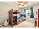 Charming bedroom with wooden bunk beds and a window, perfect for or guests at 8295 Nebula Cloud Ave, Las Vegas, NV 89131