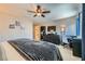 Bright bedroom featuring soft carpet, ample storage, and a serene atmosphere with a ceiling fan at 8295 Nebula Cloud Ave, Las Vegas, NV 89131