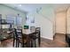 Dining area features a wood table, six chairs, and modern decor at 8295 Nebula Cloud Ave, Las Vegas, NV 89131