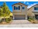 Charming two-story home with a landscaped yard and a two-car garage at 8295 Nebula Cloud Ave, Las Vegas, NV 89131