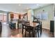 Open kitchen with stainless steel appliances, granite countertops, and a breakfast bar at 8295 Nebula Cloud Ave, Las Vegas, NV 89131
