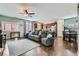 Open-concept living space with wood floors and comfortable seating at 8295 Nebula Cloud Ave, Las Vegas, NV 89131
