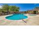 Community pool surrounded by manicured landscaping, offering a refreshing escape at 8295 Nebula Cloud Ave, Las Vegas, NV 89131