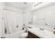 Bright bathroom with a shower-tub combo and a vanity with a white countertop at 8341 Lower Trailhead Ave, Las Vegas, NV 89113