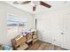 Bedroom with a window, closet, and wood-look floors, perfect for storage at 8341 Lower Trailhead Ave, Las Vegas, NV 89113