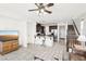 Open-concept living area with tile flooring, modern fixtures, and seamless kitchen integration at 8341 Lower Trailhead Ave, Las Vegas, NV 89113