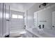 Bathroom features a shower-tub combo, modern fixtures and lighting at 836 Cherry Dr, Henderson, NV 89002