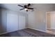 Cozy bedroom with ceiling fan and closet, freshly painted in neutral colors at 836 Cherry Dr, Henderson, NV 89002