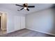 Comfortable bedroom featuring a ceiling fan and double door closet at 836 Cherry Dr, Henderson, NV 89002