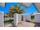 Private front courtyard with a wooden deck, a decorative wall, and a secure gate at 836 Cherry Dr, Henderson, NV 89002