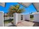 Private front courtyard with a wooden deck, a decorative wall, and a secure gate at 836 Cherry Dr, Henderson, NV 89002