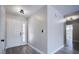 Clean entryway featuring updated light fixtures and grey laminate flooring at 836 Cherry Dr, Henderson, NV 89002